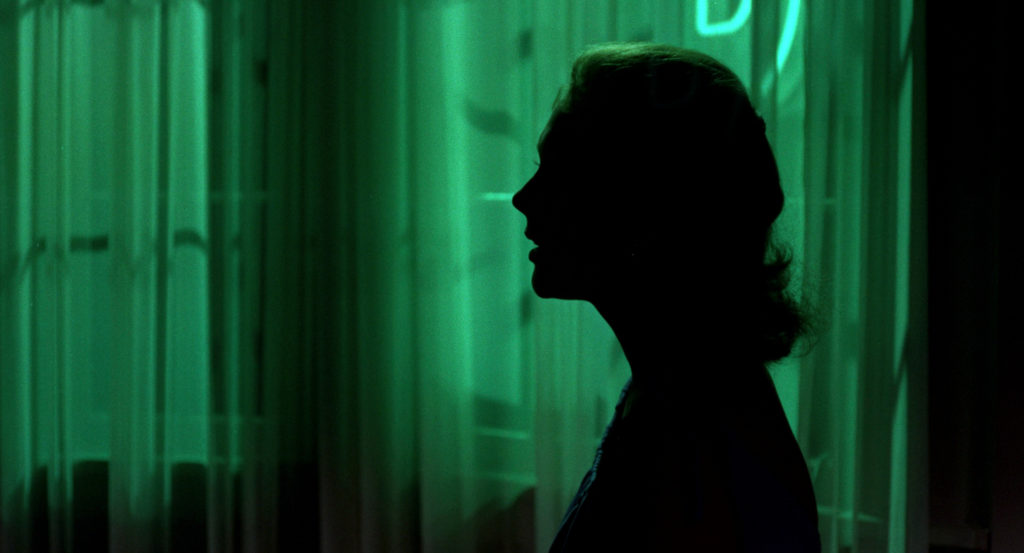 Kim Novak silhouetted against green. Color palettes